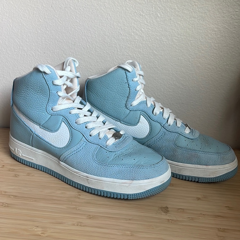 Blue and white nike Air Force ones